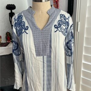 Classy Chico’s blouse with a floral embroidered pattern.